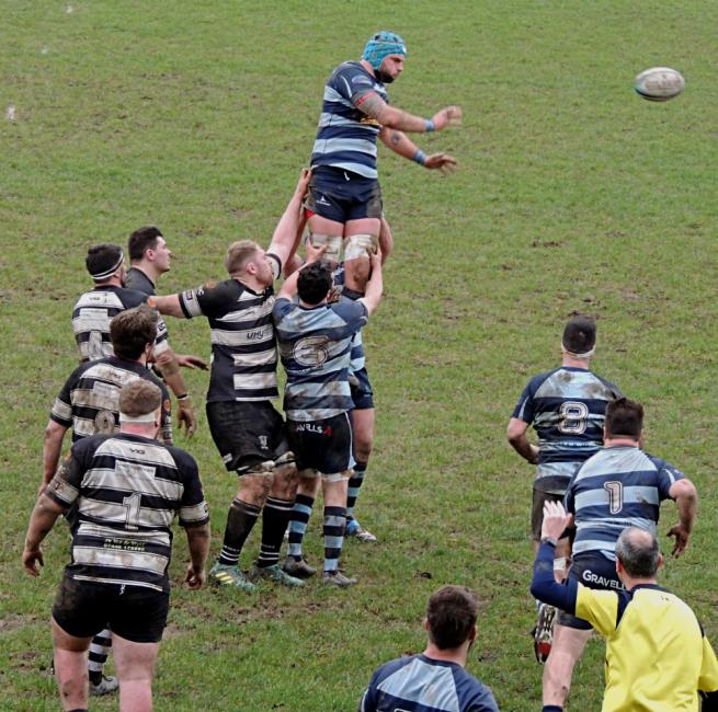 Alex Jenkins gets the ball away 